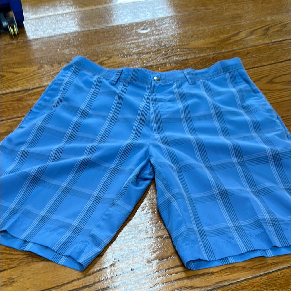 Callaway blue plaid golf shorts.  Flat front. Size 34 waist with 10.5” inseam.